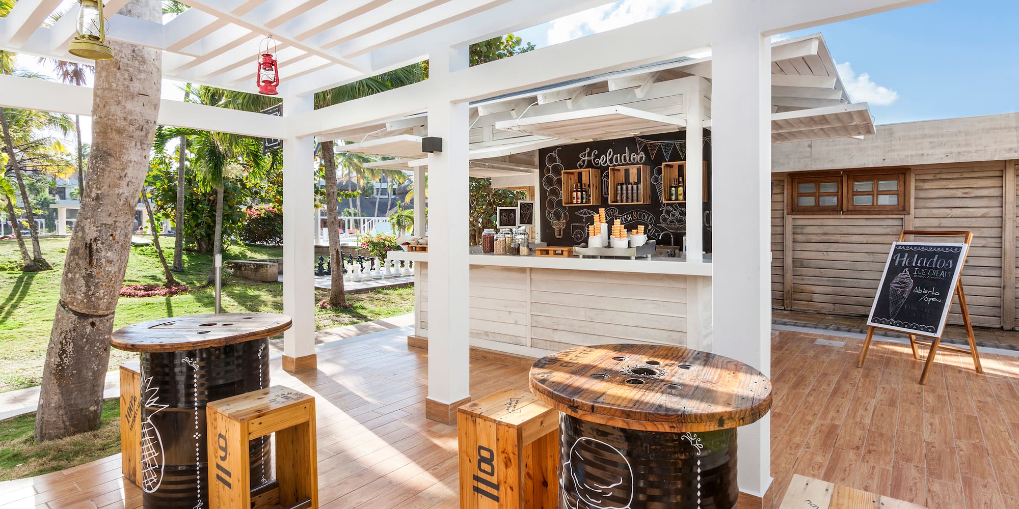 a patio with tables and chairs