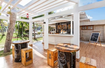 a patio with tables and chairs