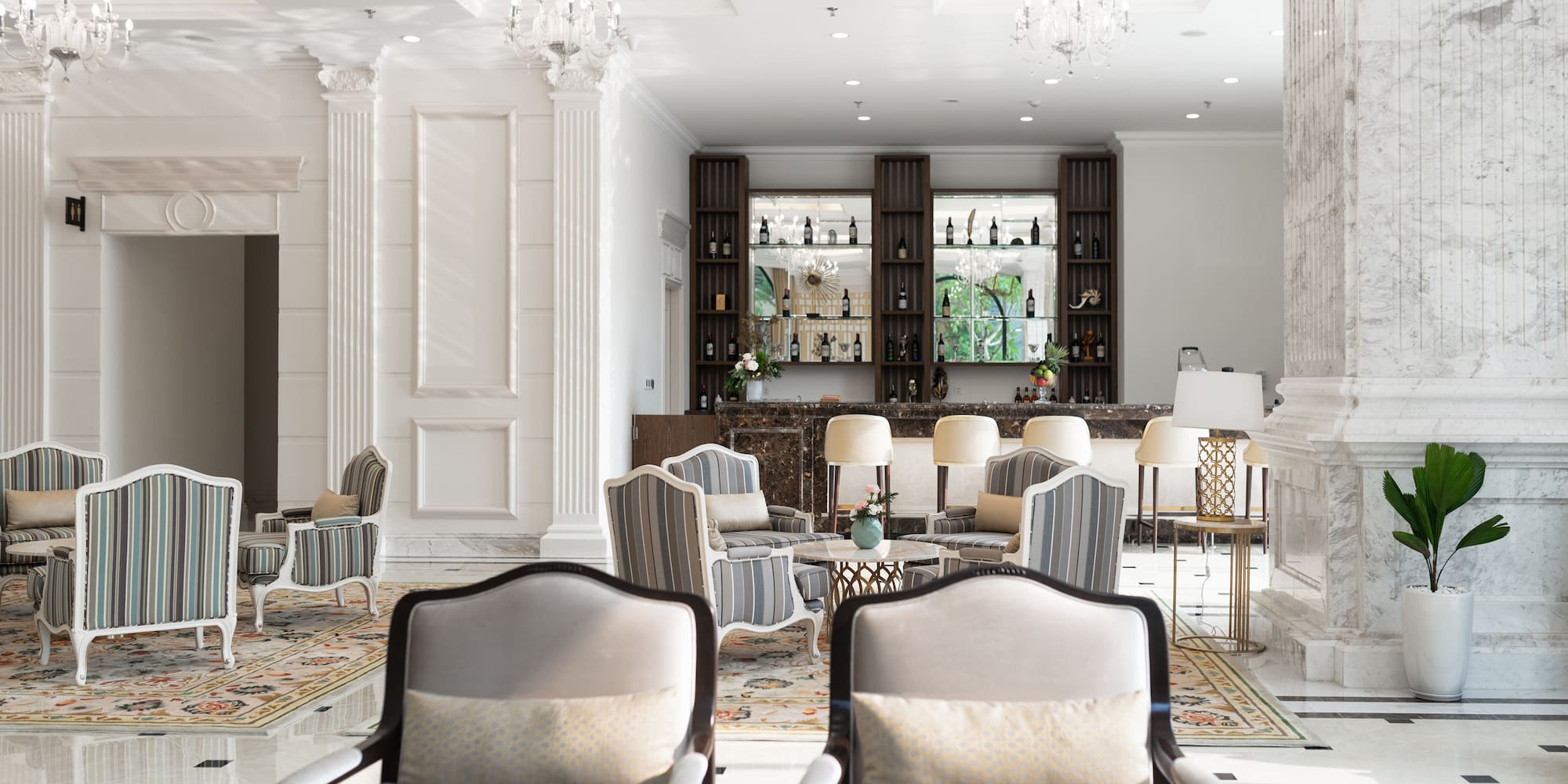 a room with chairs and a bar