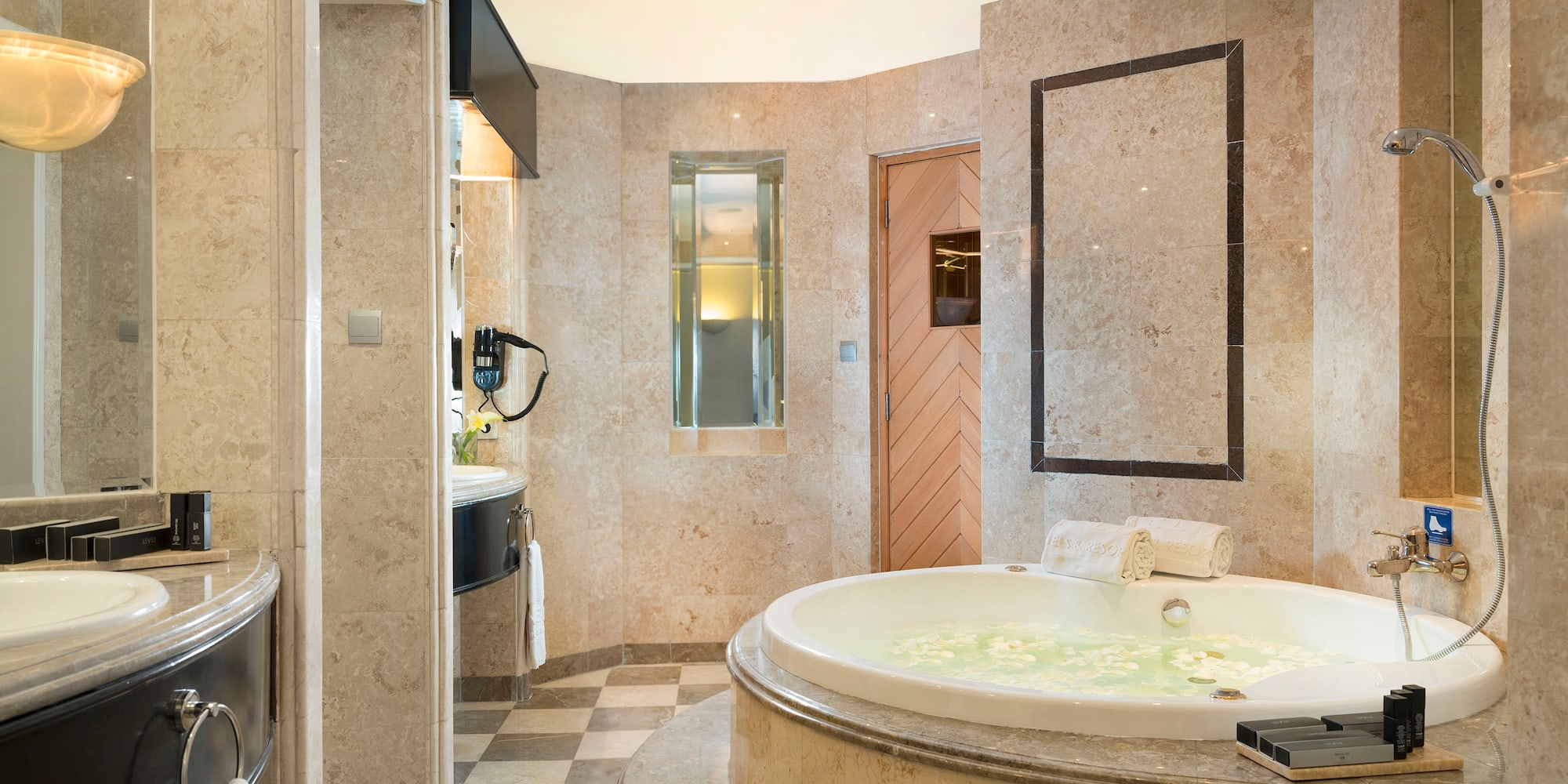 a bathroom with a large tub and a sink