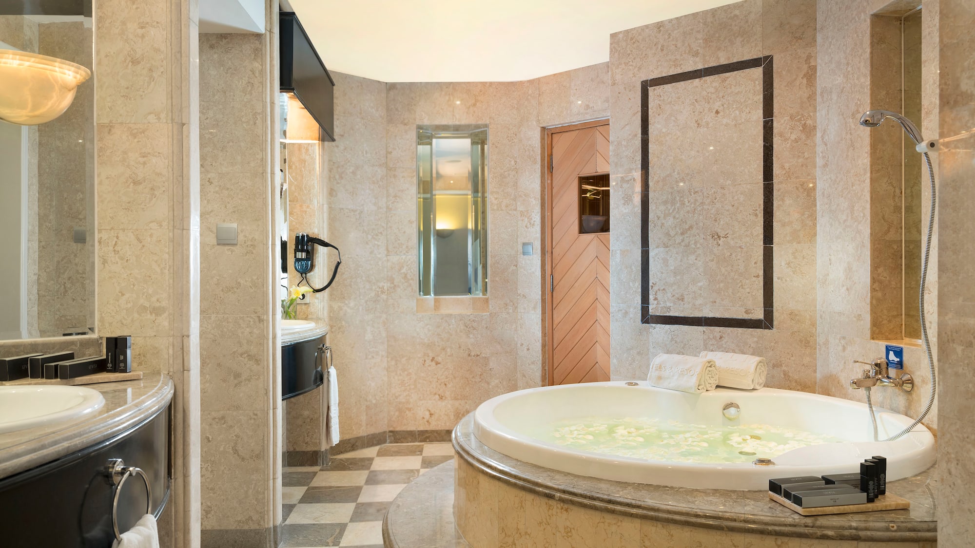 a bathroom with a large tub and a sink