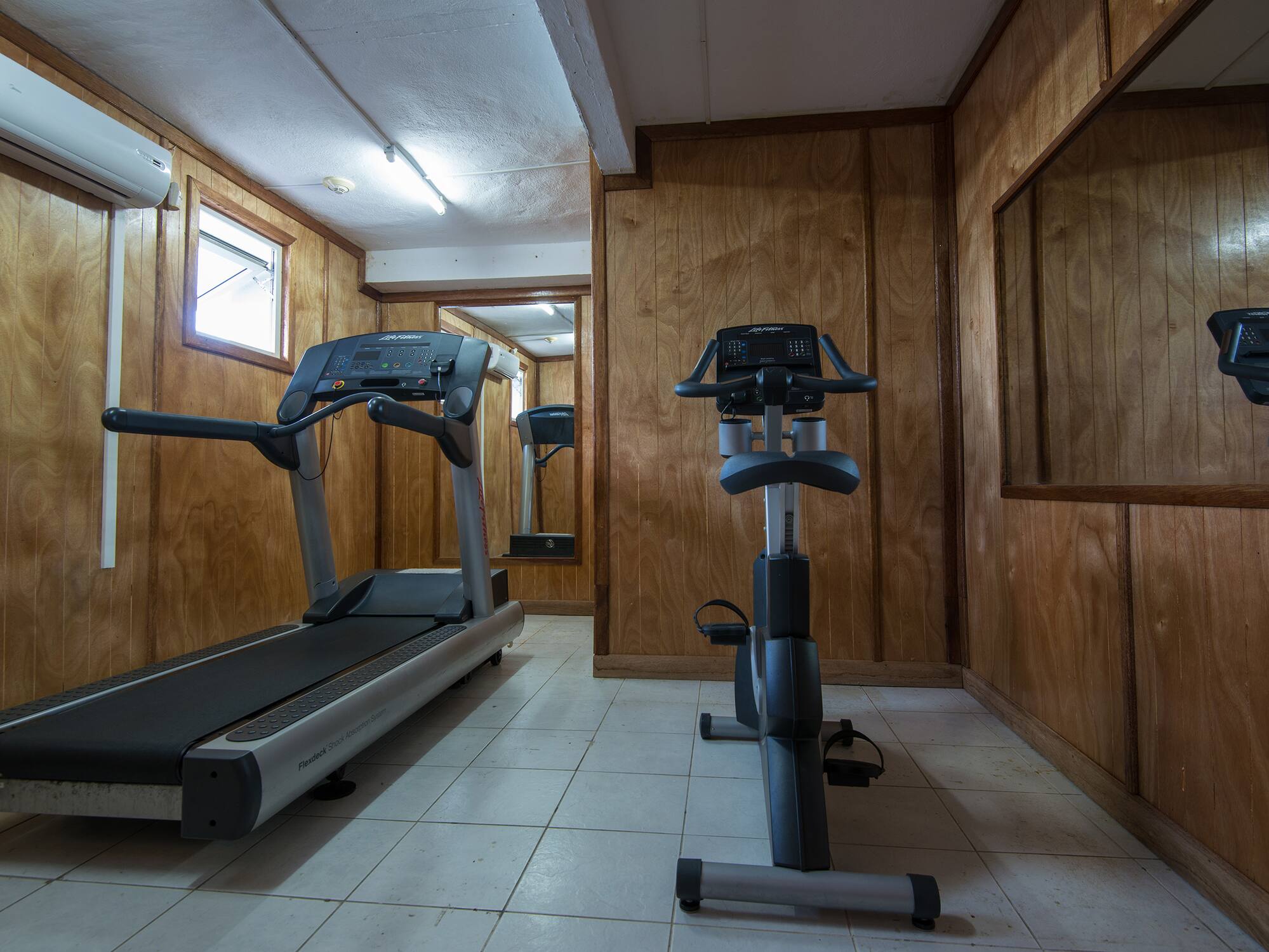 a room with treadmills and exercise bikes