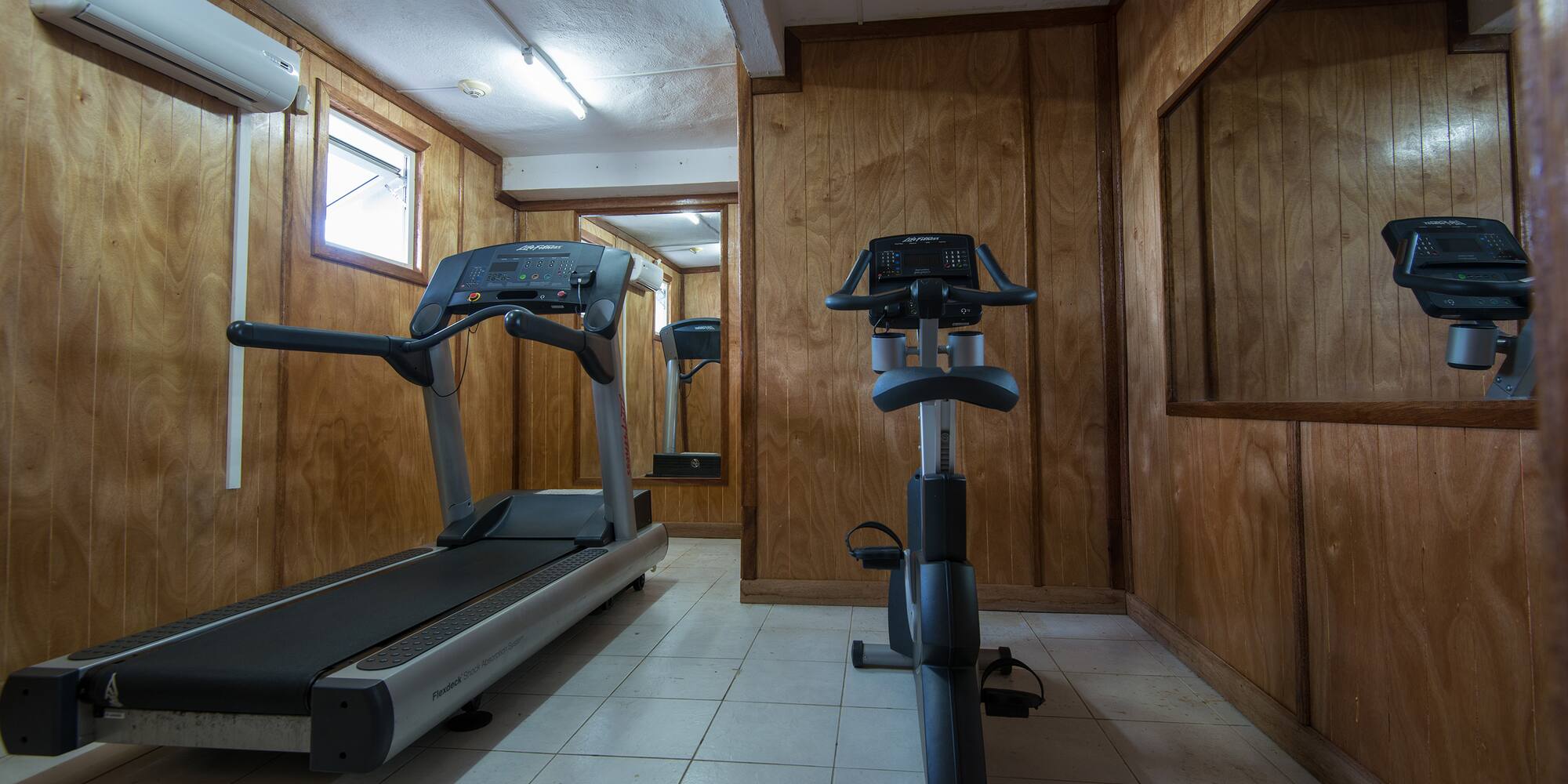 a room with treadmills and exercise bikes