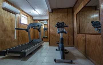 a room with treadmills and exercise bikes
