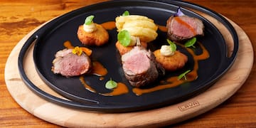 a plate of food on a wooden surface