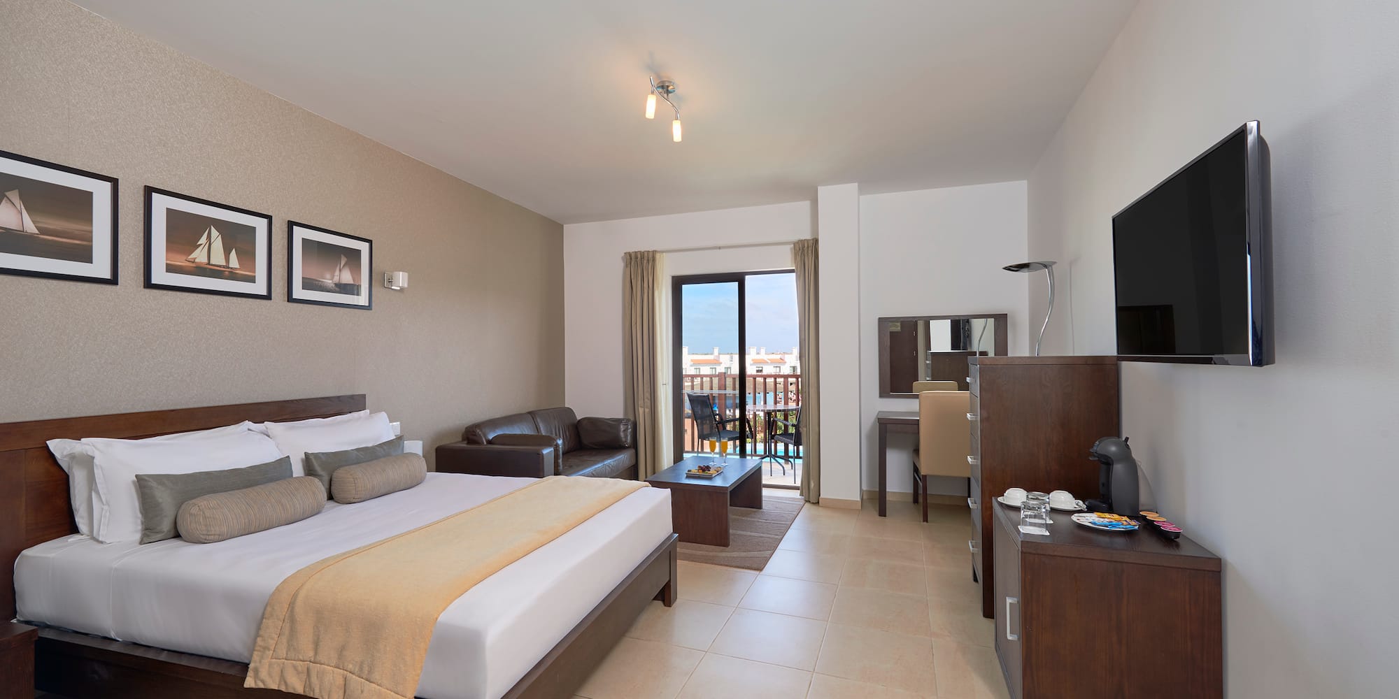 a bedroom with a television and a bed