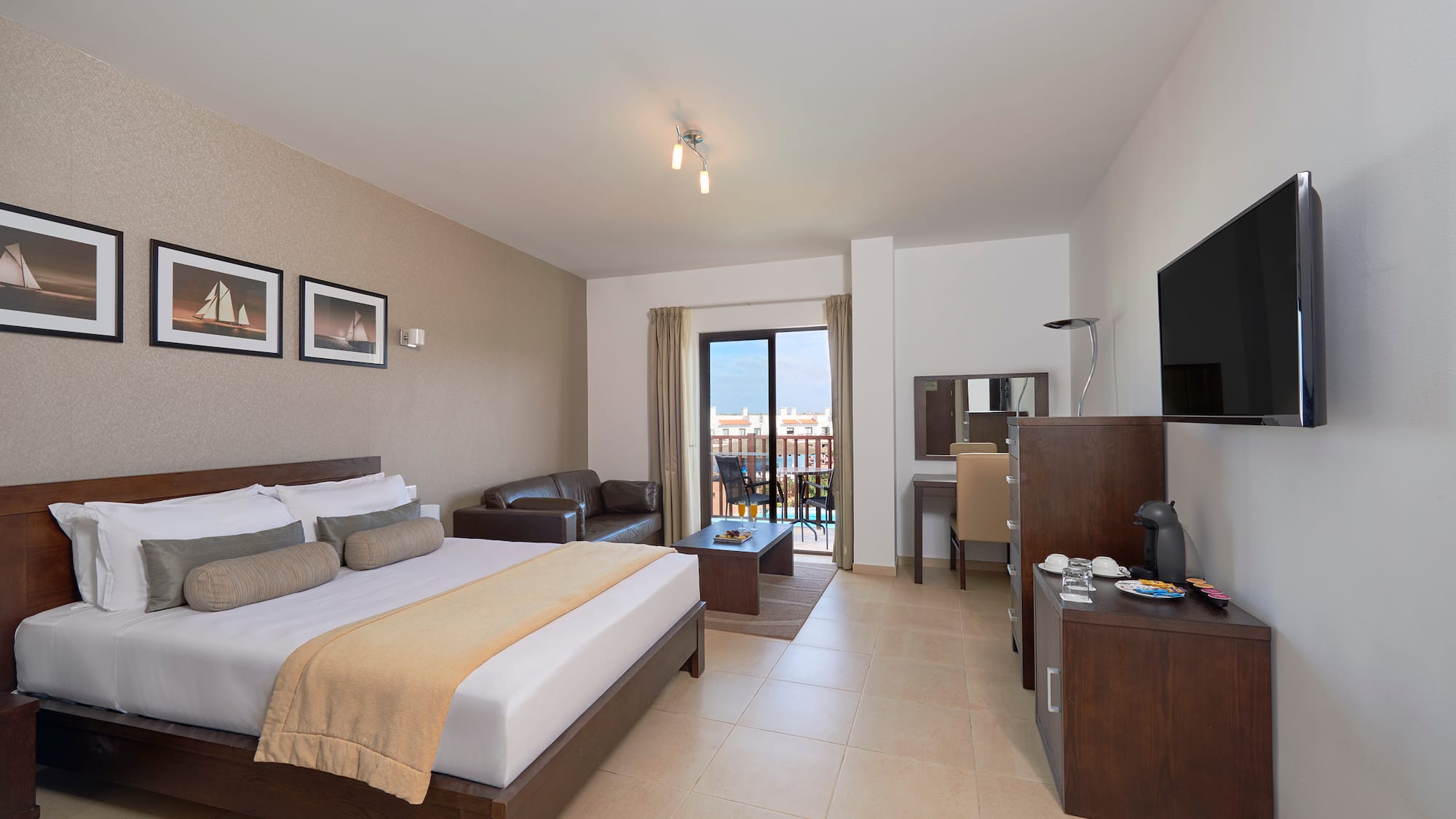 a bedroom with a television and a bed