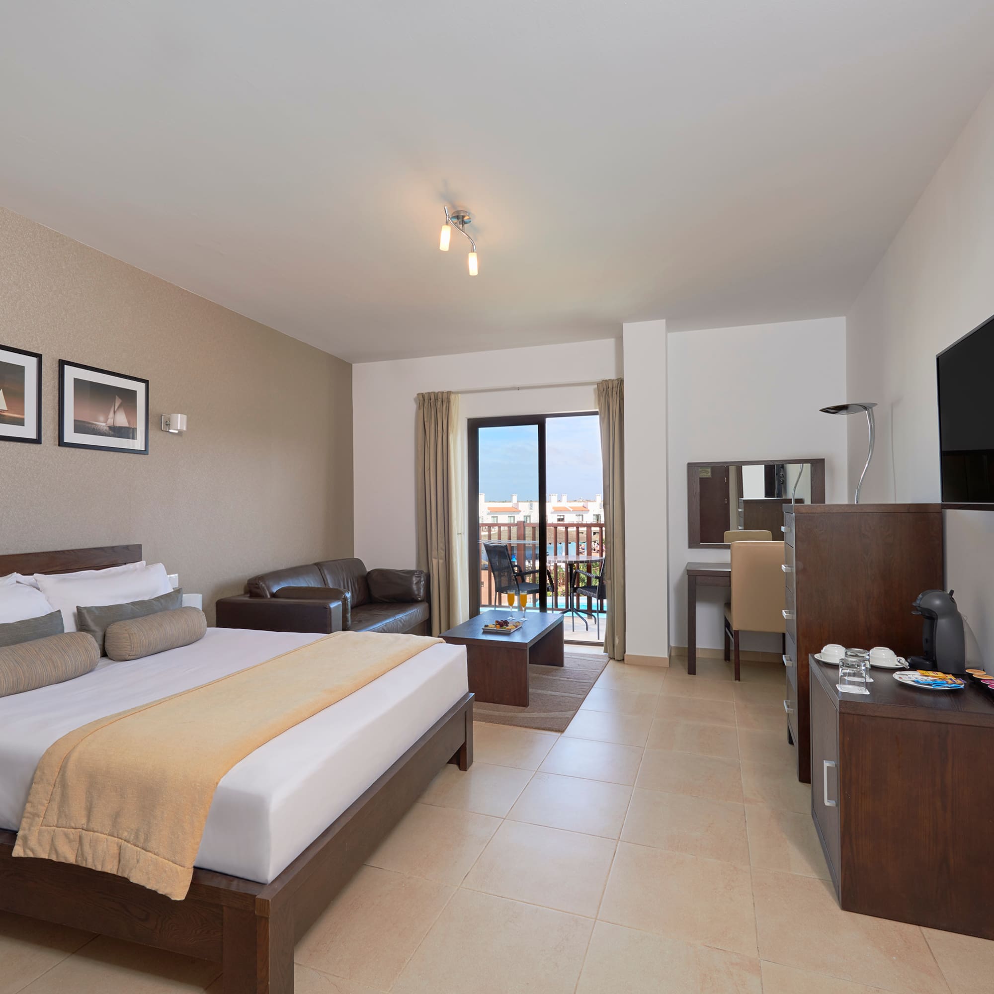 a bedroom with a television and a bed