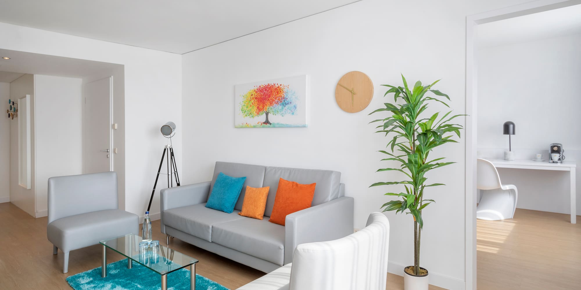 a living room with a couch and a plant