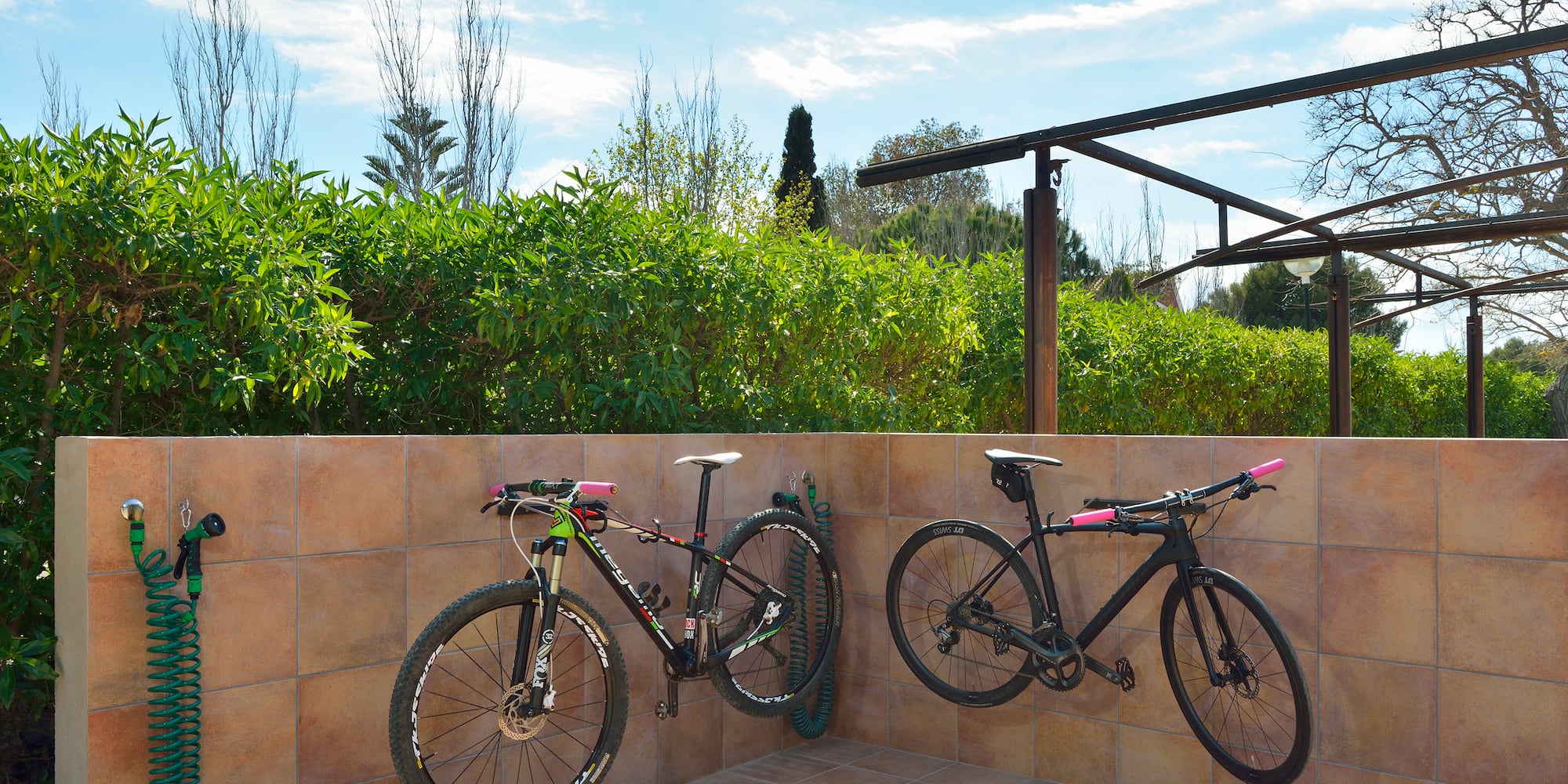 two bicycles on a wall