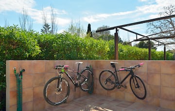 two bicycles on a wall
