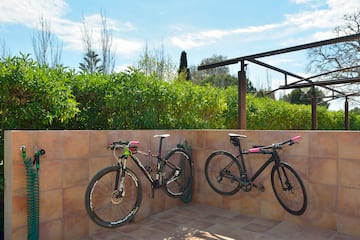 two bicycles on a wall