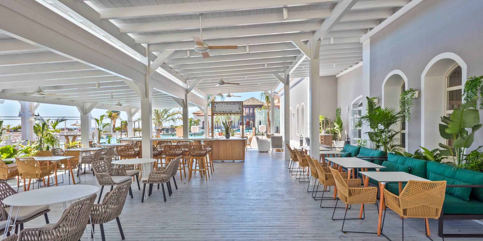 a large patio with tables and chairs