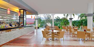 a patio with tables and chairs