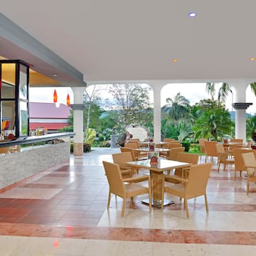 a patio with tables and chairs