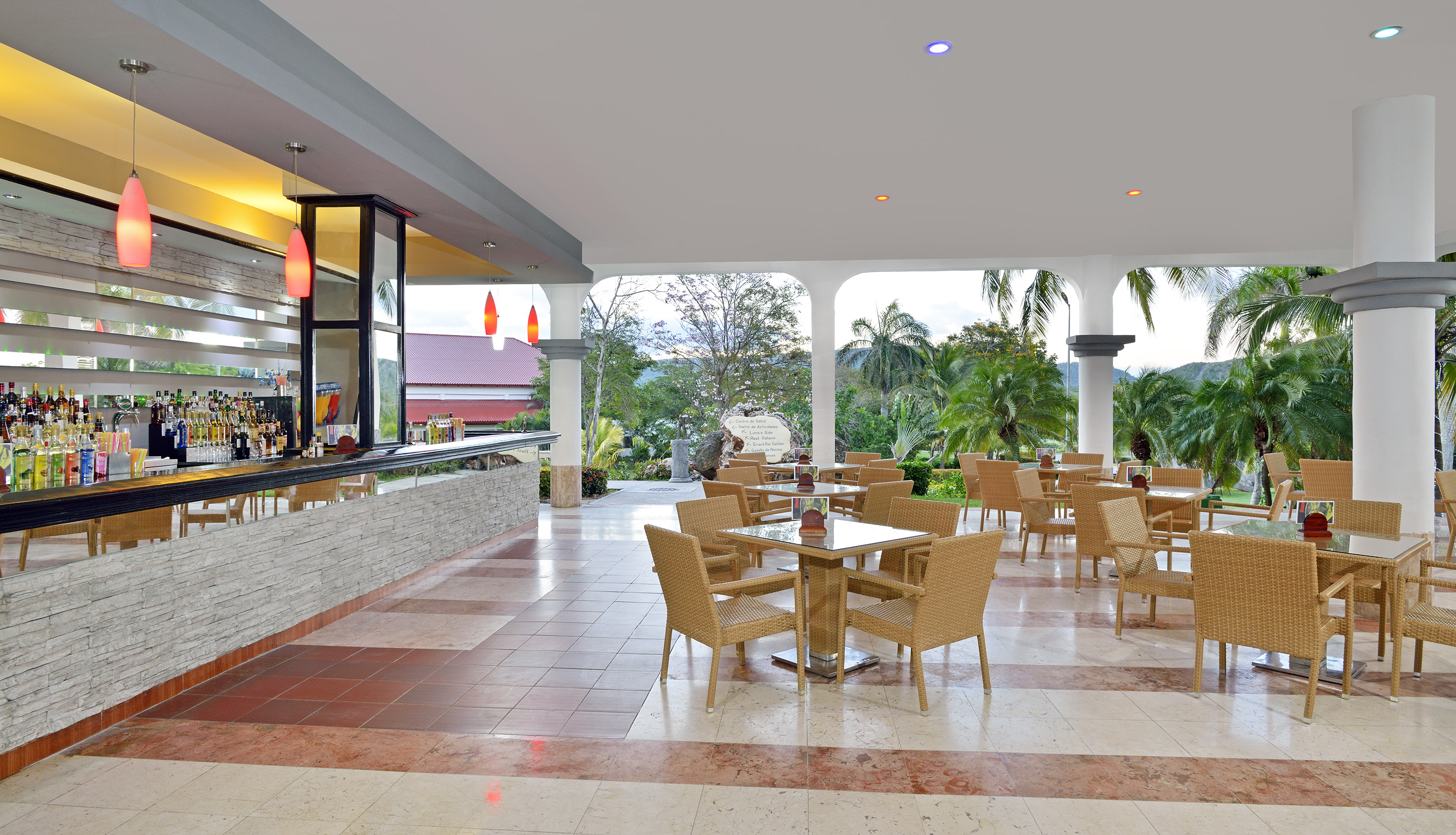a patio with tables and chairs