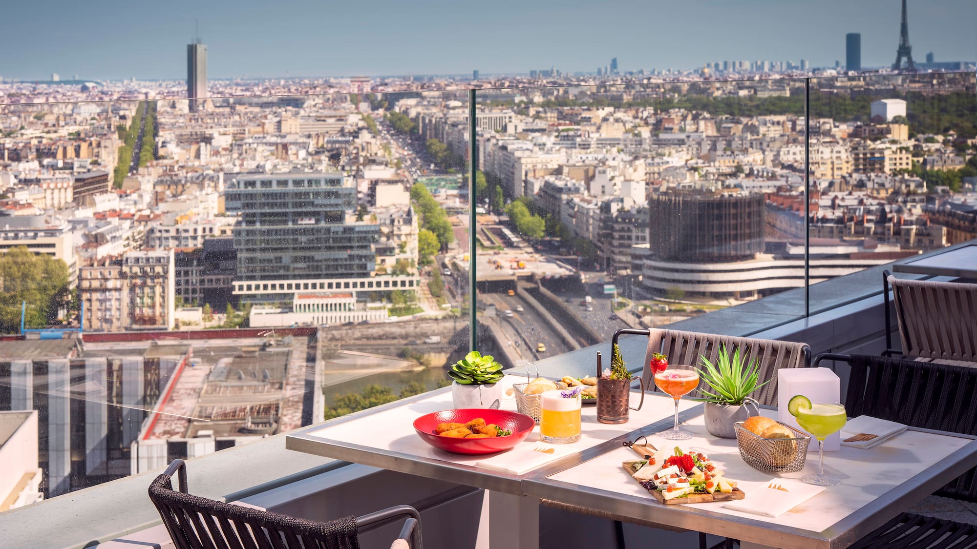 a table with food on it and a city view
