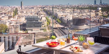 a table with food on it and a city view