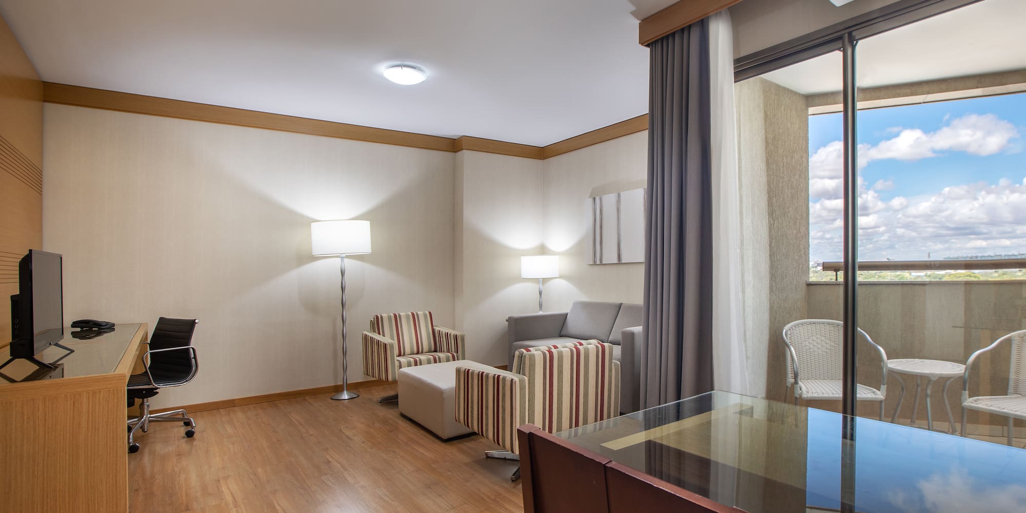 a room with a piano and chairs