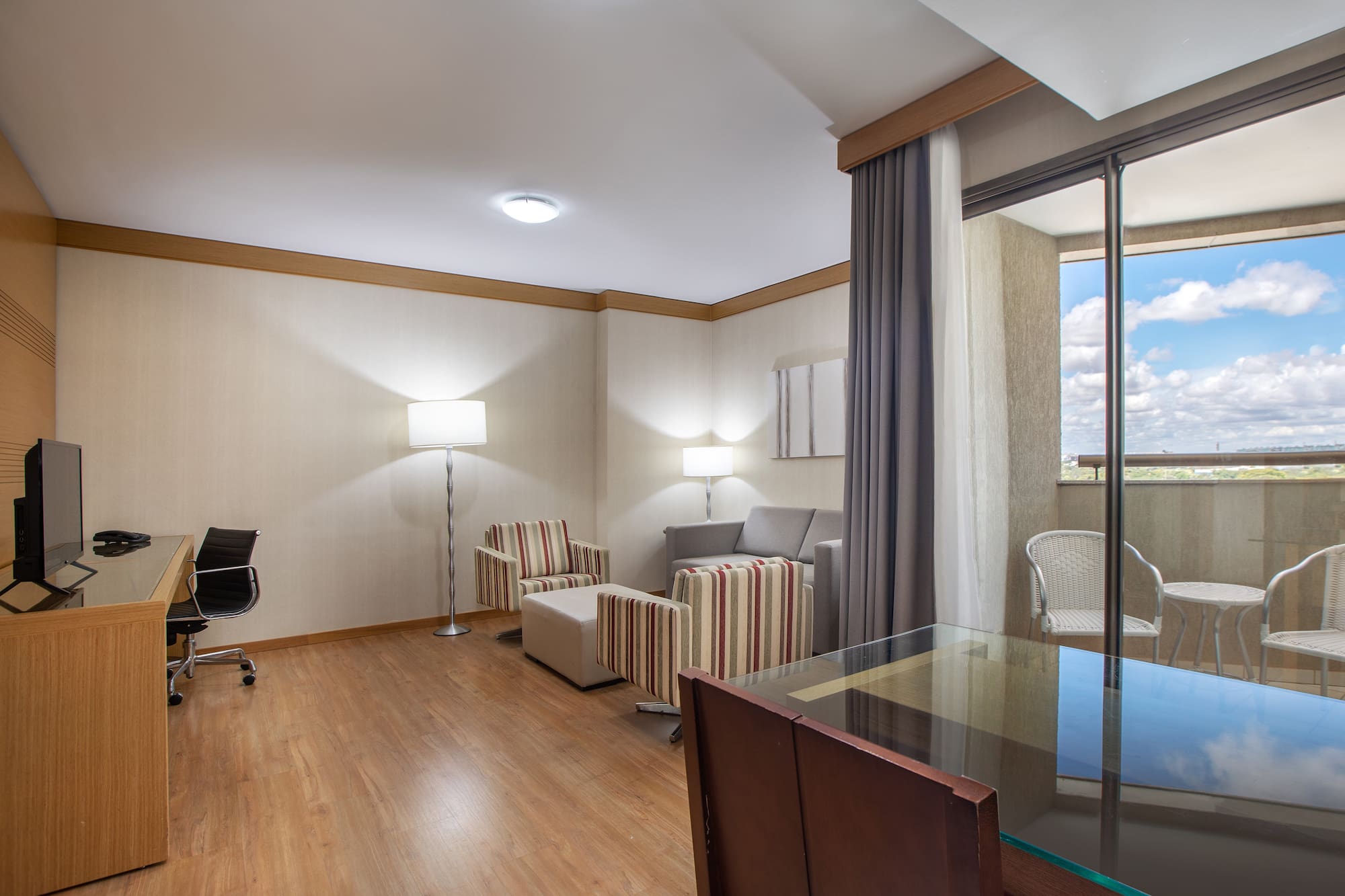 a room with a piano and chairs