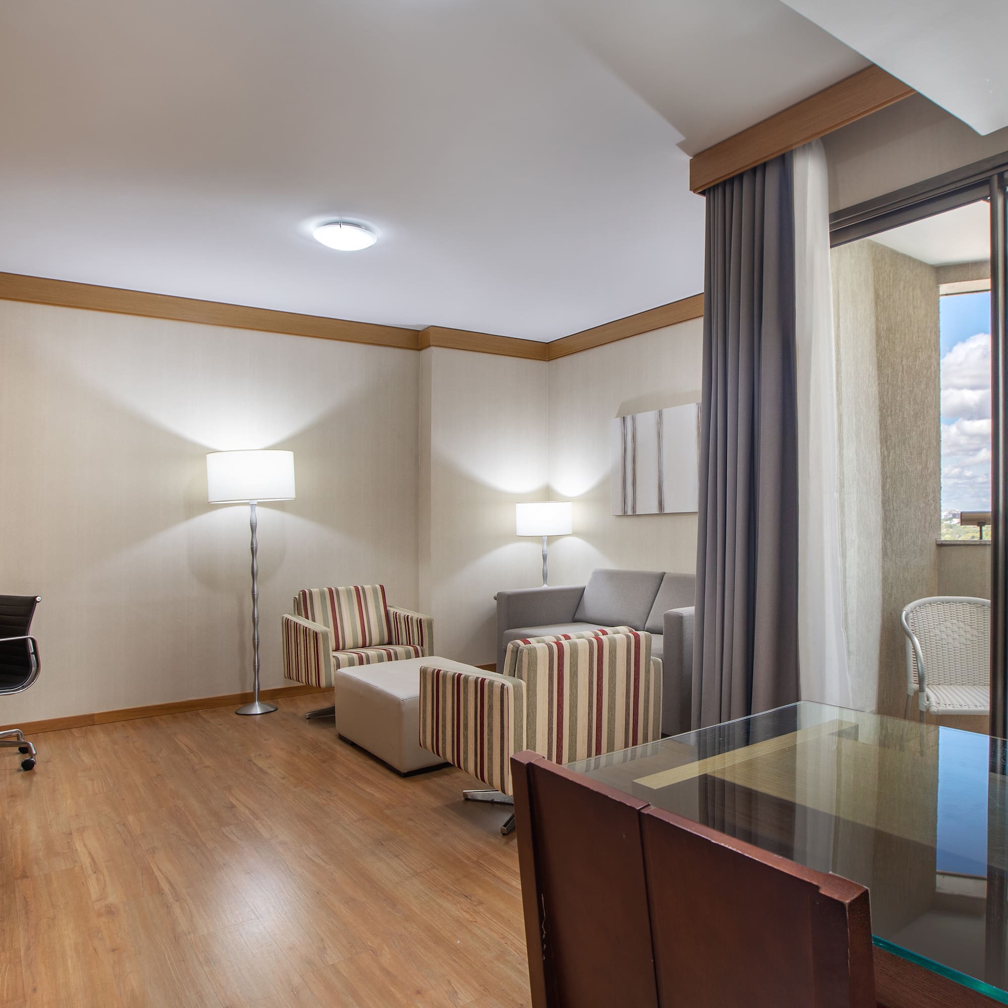 a room with a piano and chairs