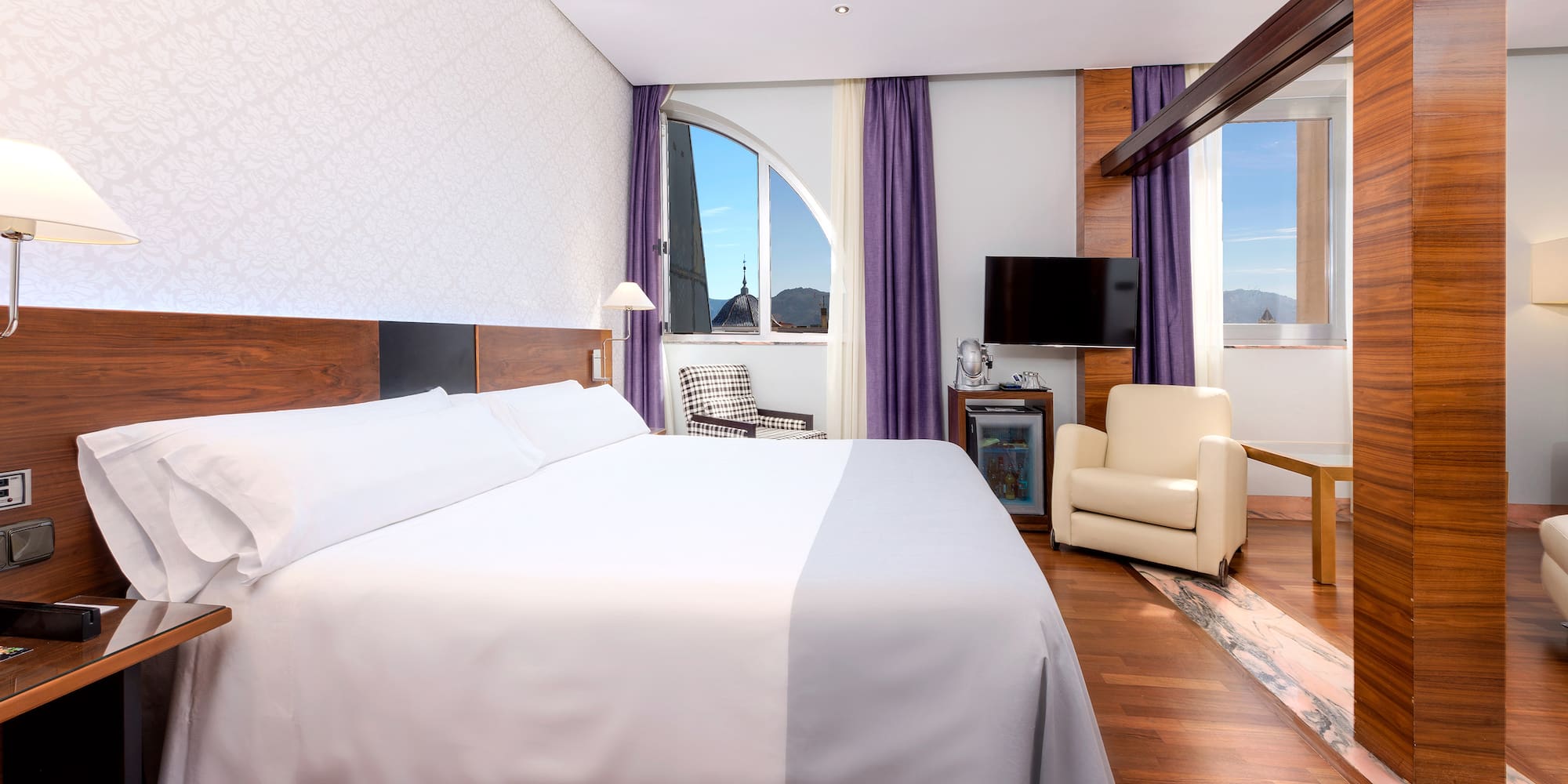 a room with a bed and a chair