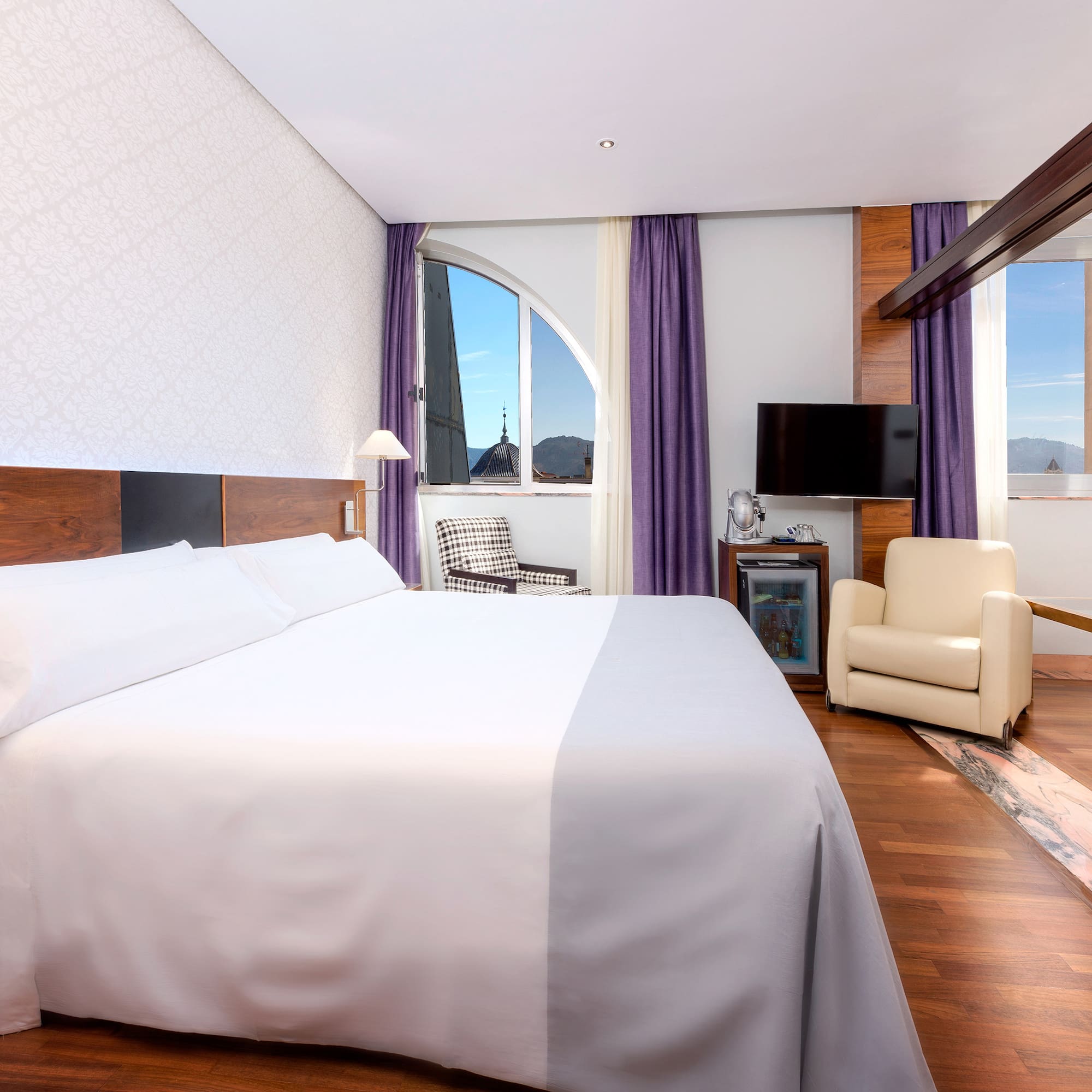 a room with a bed and a chair