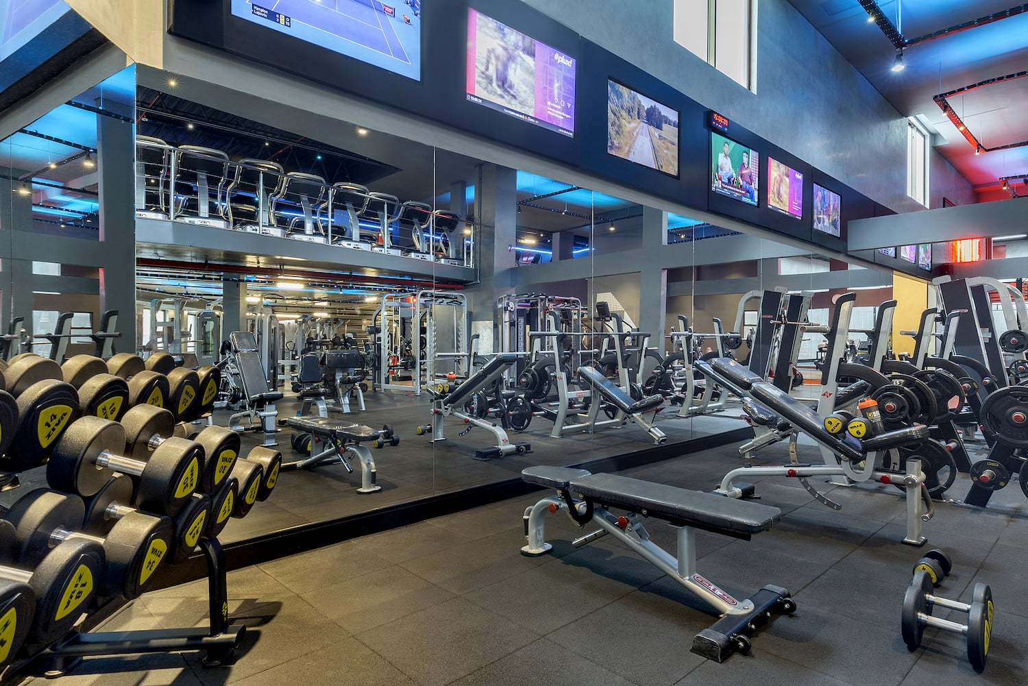 a large gym with several equipment