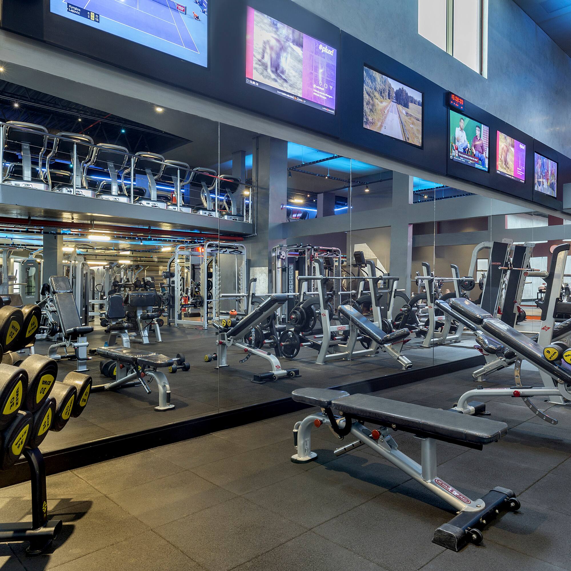 a large gym with several equipment