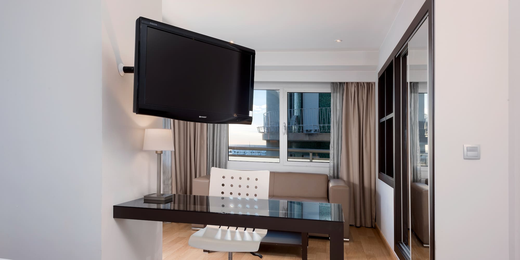 a room with a television mounted on the wall