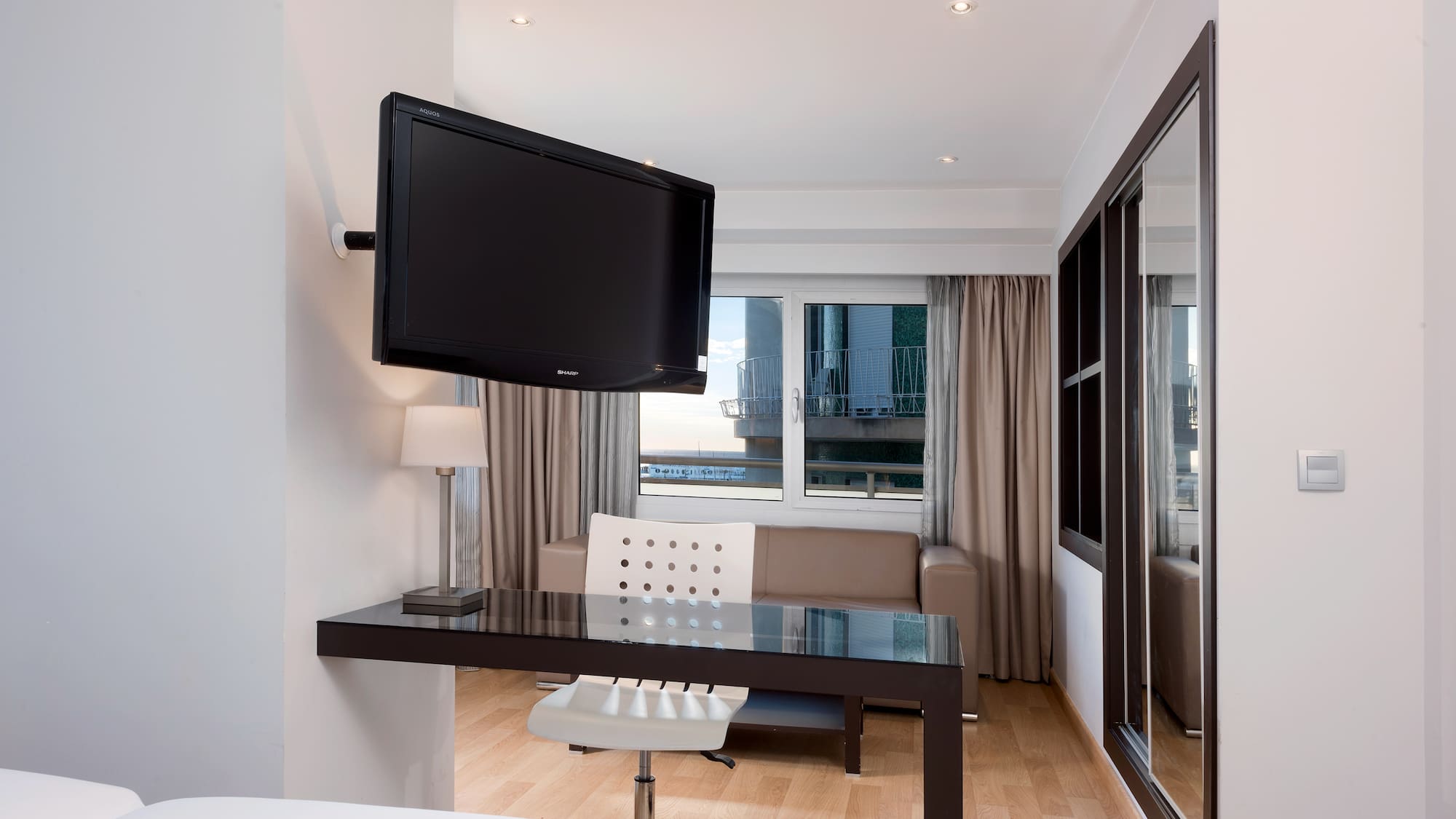 a room with a television mounted on the wall
