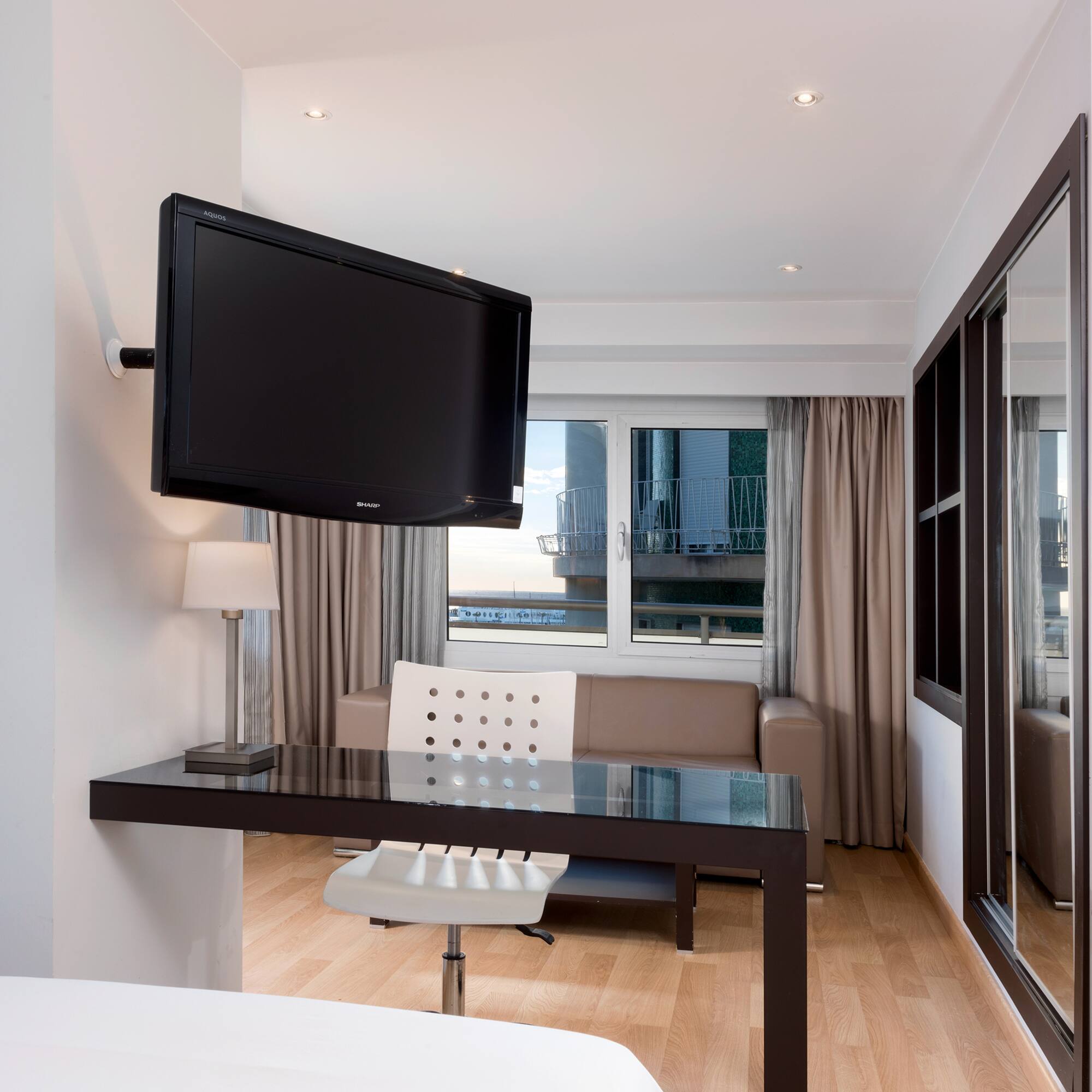 a room with a television mounted on the wall