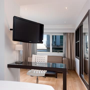 a room with a television mounted on the wall