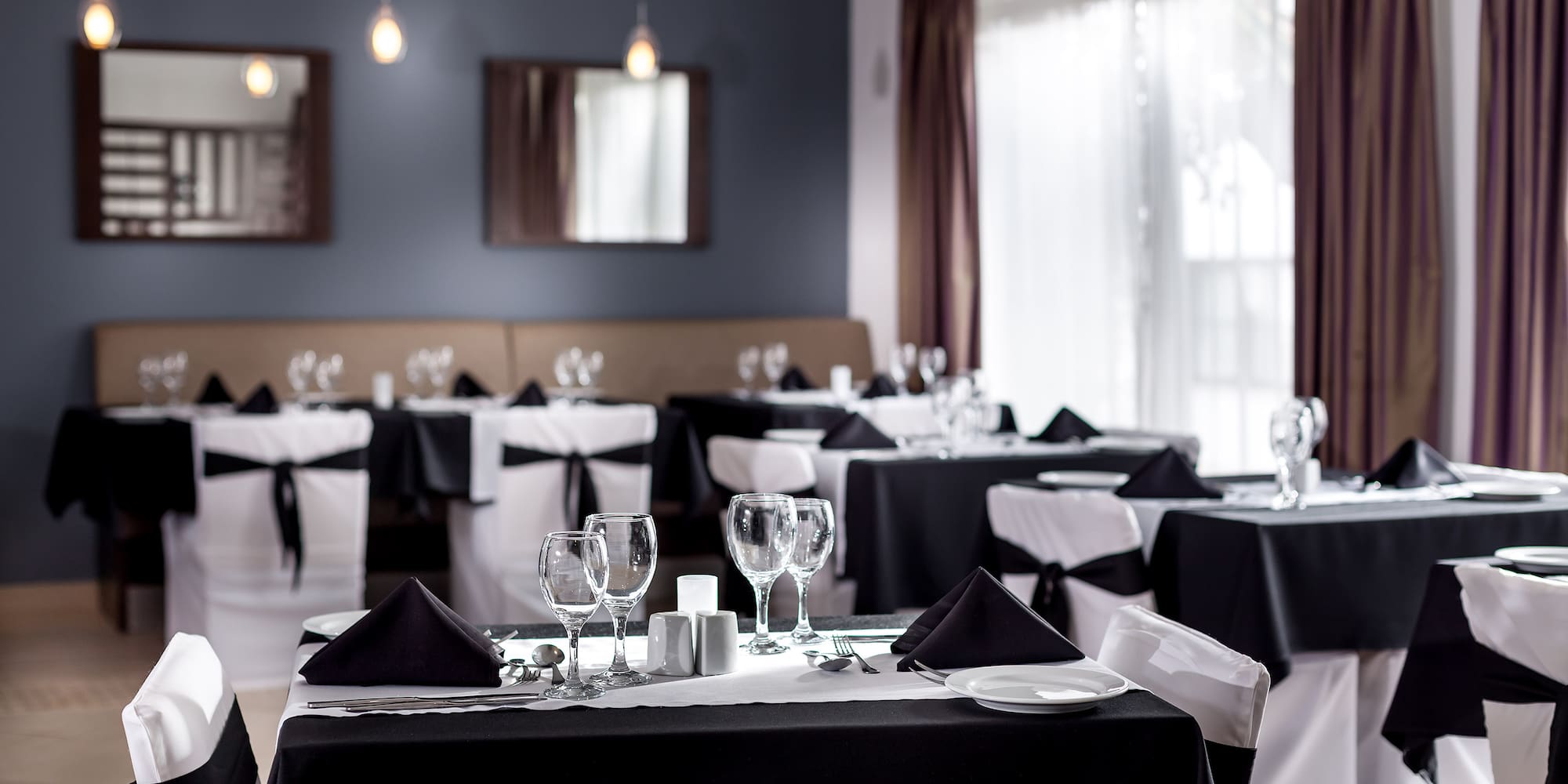 a restaurant with tables and chairs