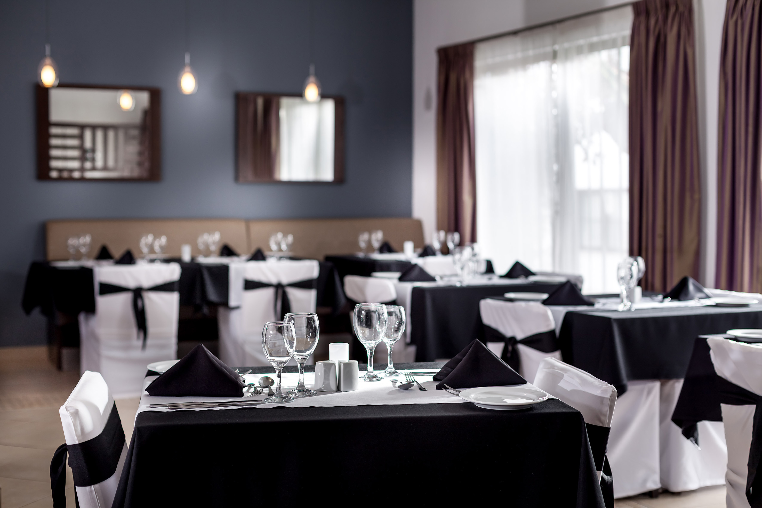 a restaurant with tables and chairs