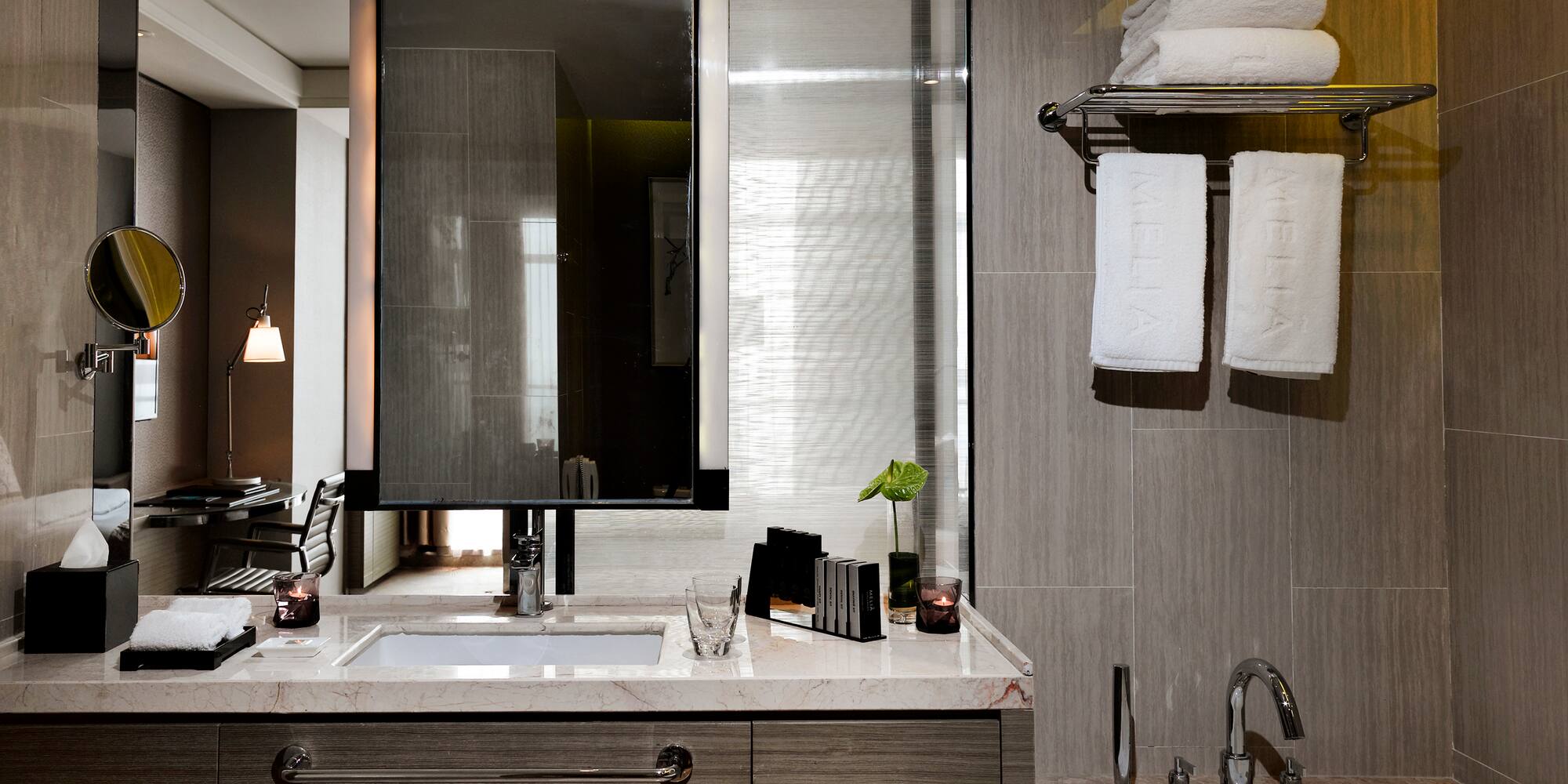 a bathroom with a mirror and sink