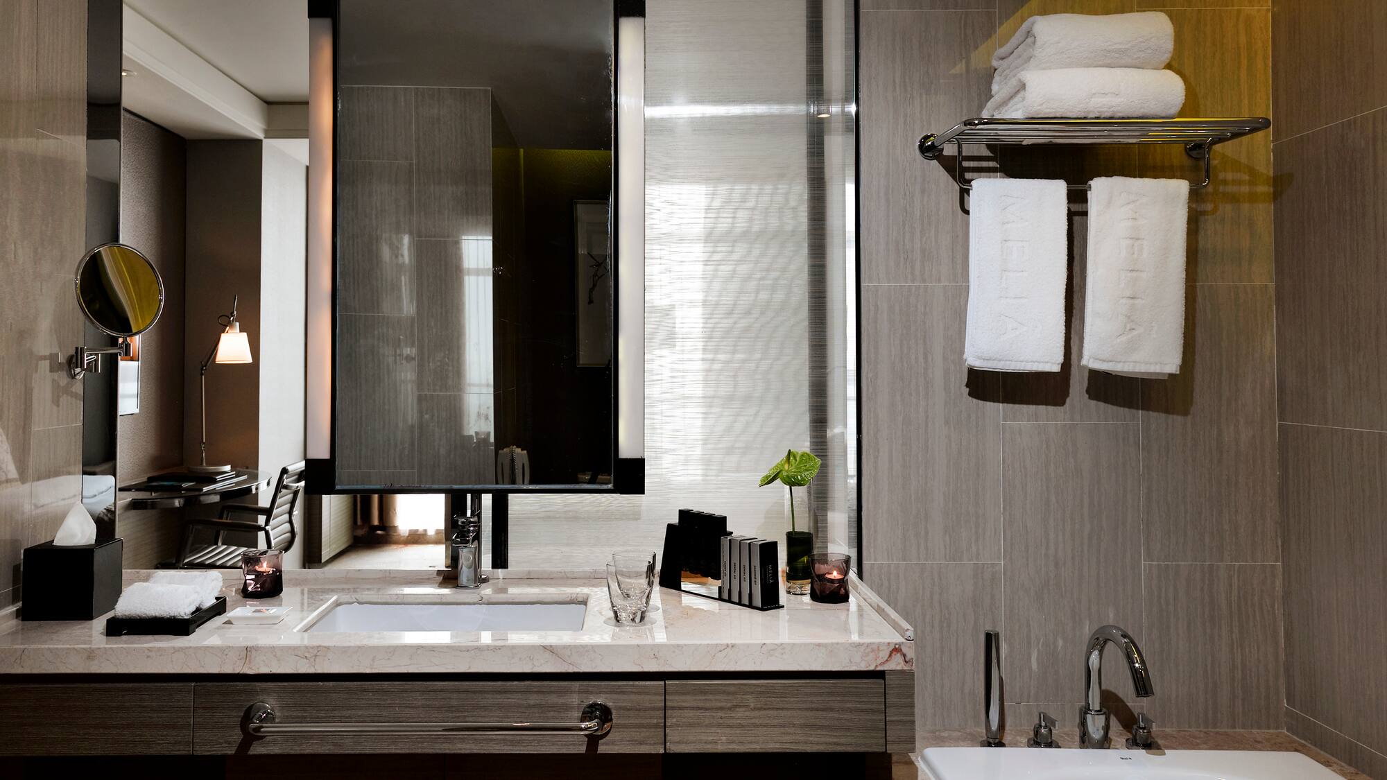 a bathroom with a mirror and sink