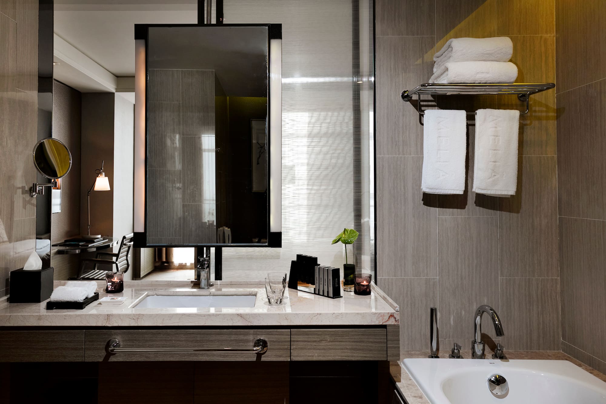 a bathroom with a mirror and sink