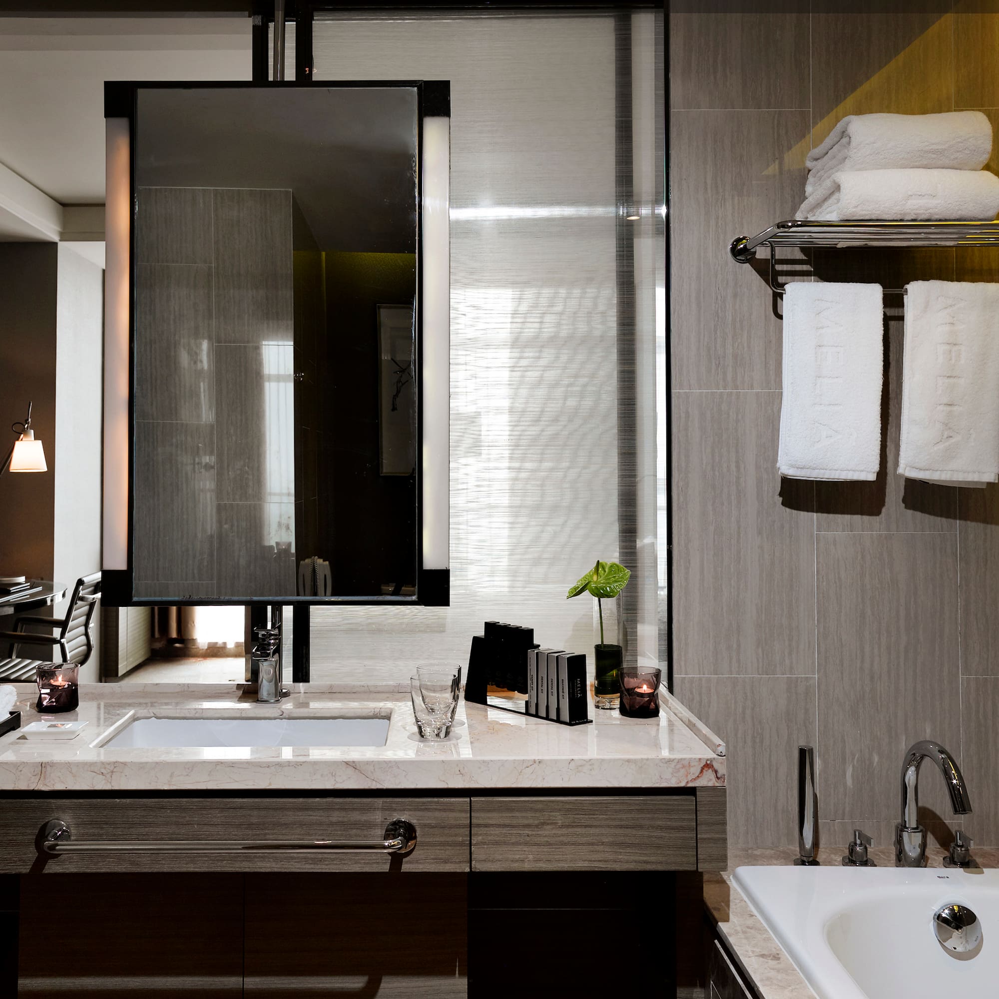 a bathroom with a mirror and sink