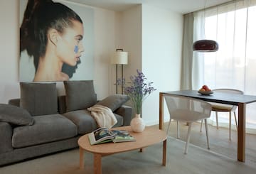 a living room with a couch and table