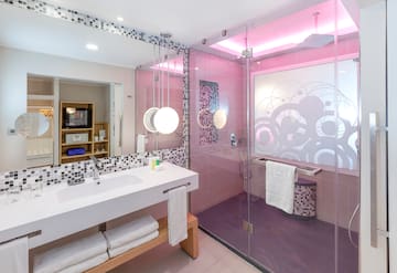 a bathroom with a glass shower and sink