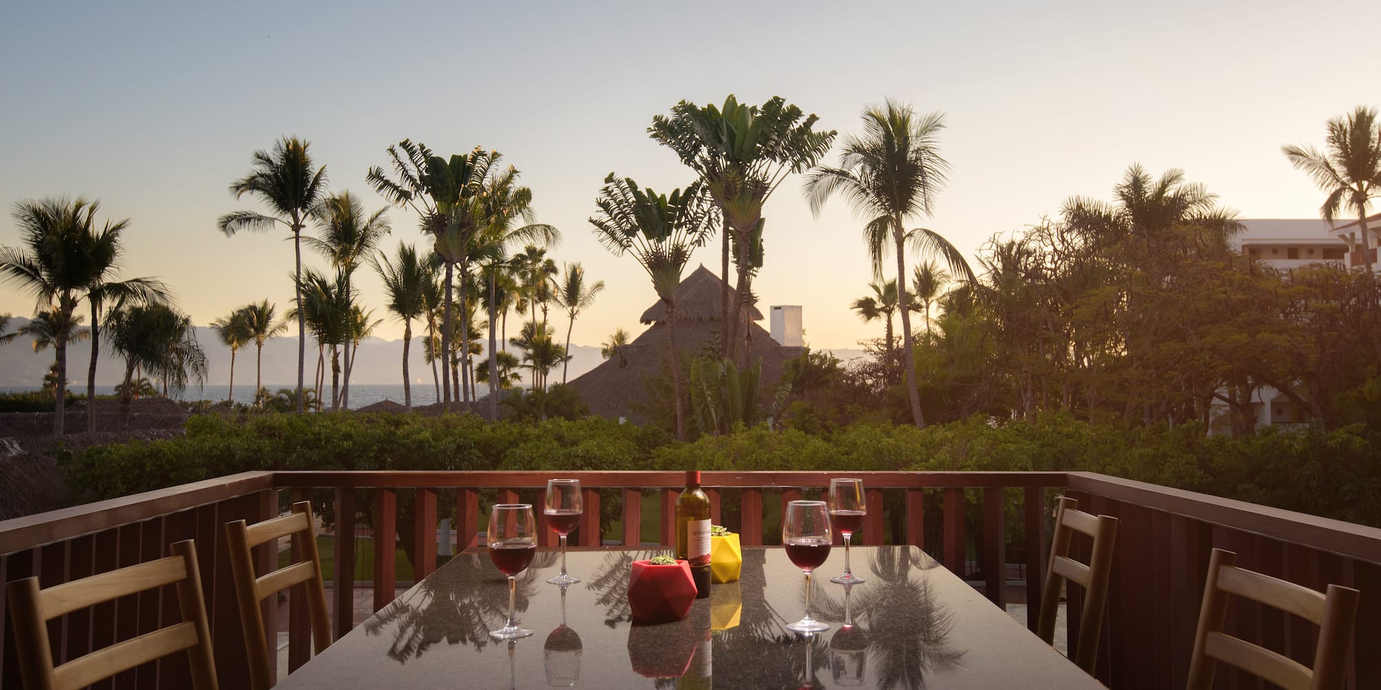 a table with wine glasses and bottles on it