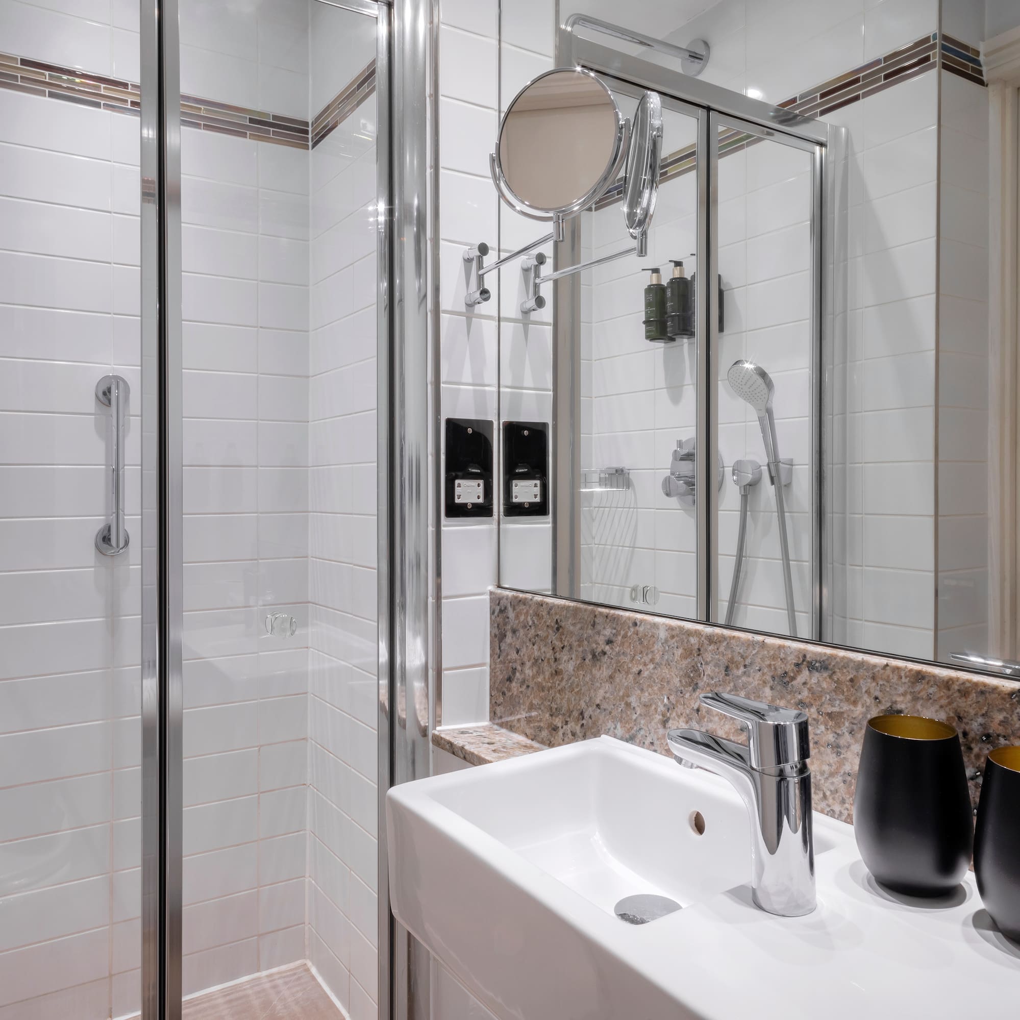 a bathroom with a shower and sink