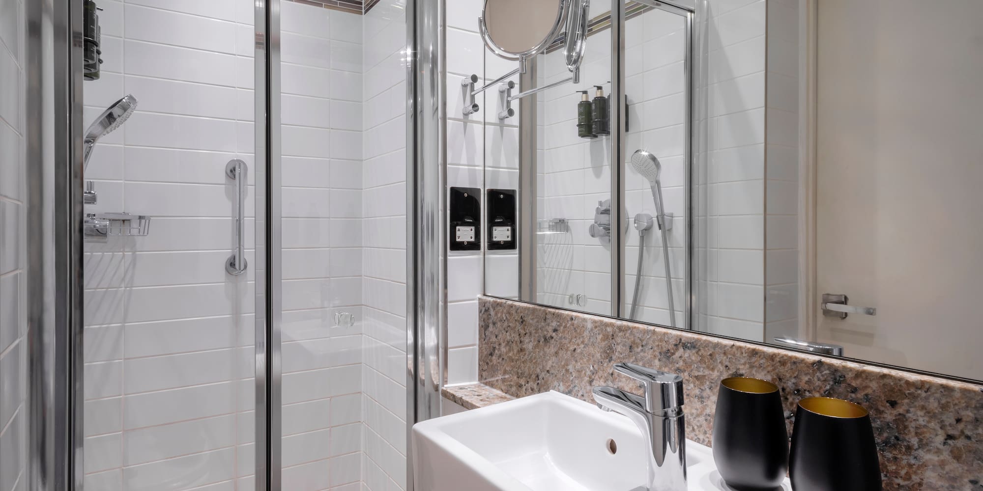 a bathroom with a shower and sink