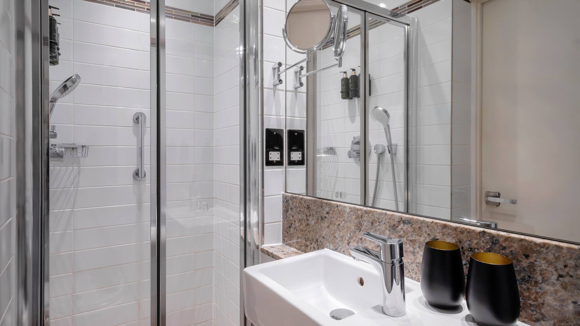 a bathroom with a shower and sink