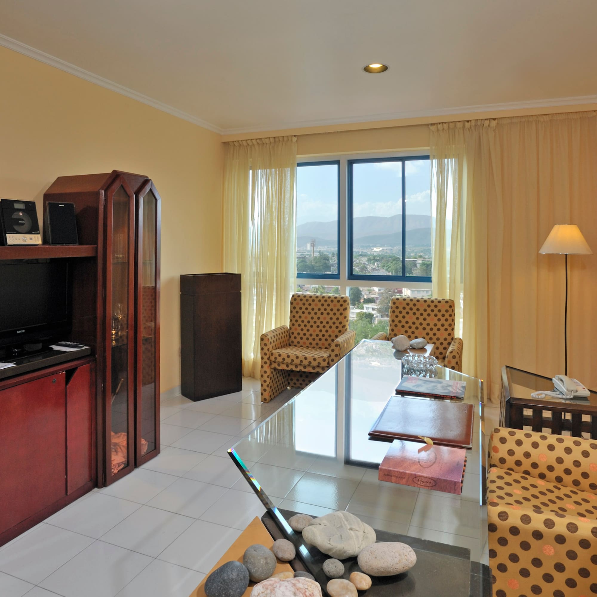 a room with a television and a table