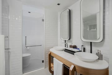 a bathroom with a shower and sink