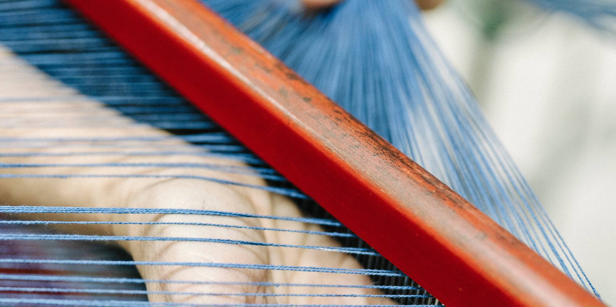 a person using a loom