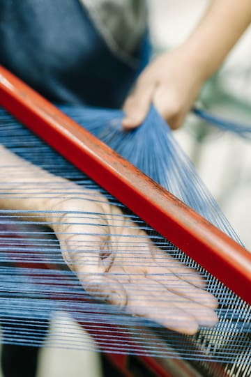 a person using a loom