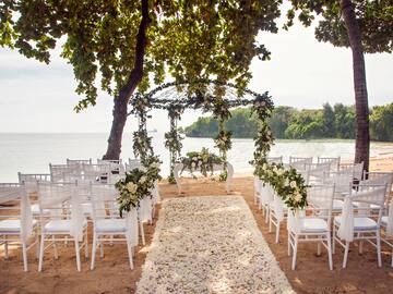 a wedding ceremony set up on the beach